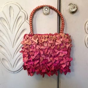 Augustine’s Leather pink purse.